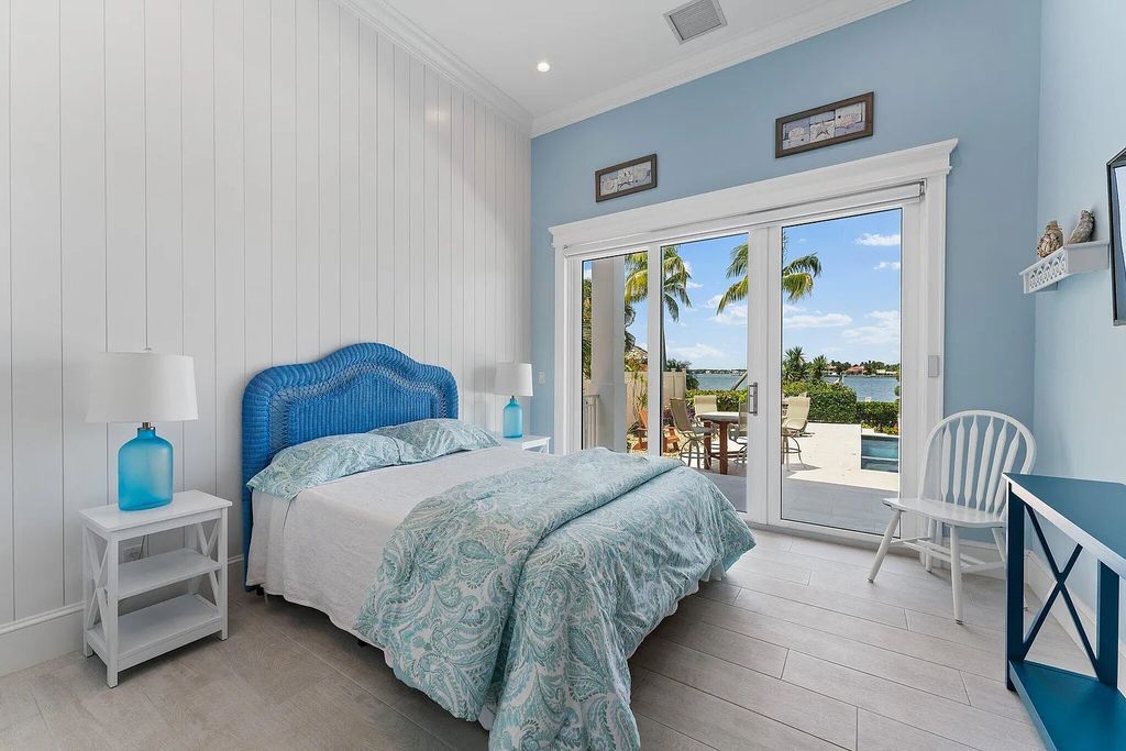 Introducing 5874 Pennock Point Road, a luxurious estate in Jupiter, Florida. This stunning property offers 5 bedrooms, 8 bathrooms, and 7,434 square feet of living space.