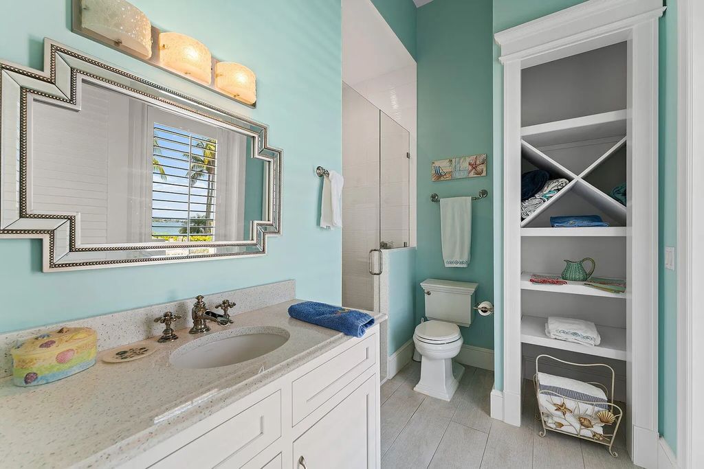 Introducing 5874 Pennock Point Road, a luxurious estate in Jupiter, Florida. This stunning property offers 5 bedrooms, 8 bathrooms, and 7,434 square feet of living space.