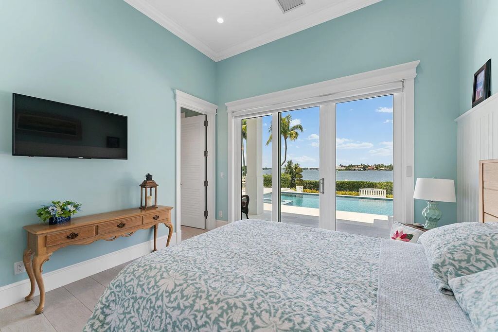 Introducing 5874 Pennock Point Road, a luxurious estate in Jupiter, Florida. This stunning property offers 5 bedrooms, 8 bathrooms, and 7,434 square feet of living space.