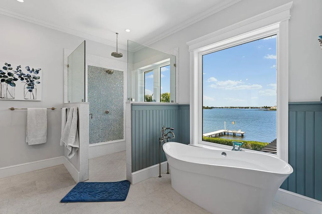 Introducing 5874 Pennock Point Road, a luxurious estate in Jupiter, Florida. This stunning property offers 5 bedrooms, 8 bathrooms, and 7,434 square feet of living space.