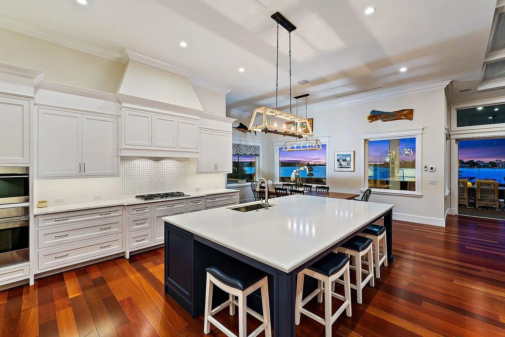 Introducing 5874 Pennock Point Road, a luxurious estate in Jupiter, Florida. This stunning property offers 5 bedrooms, 8 bathrooms, and 7,434 square feet of living space.