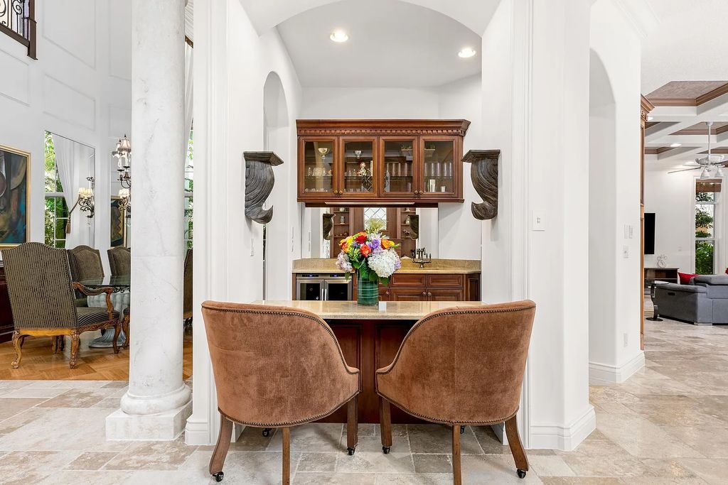 Discover 8382 Del Prado Drive, a luxurious residence in Delray Beach's acclaimed Mizner Country Club. With 5 bedrooms, 8 bathrooms, and 7,684 square feet of living space, this meticulously designed home offers artisanal beauty, Mediterranean ambience, and comfort.