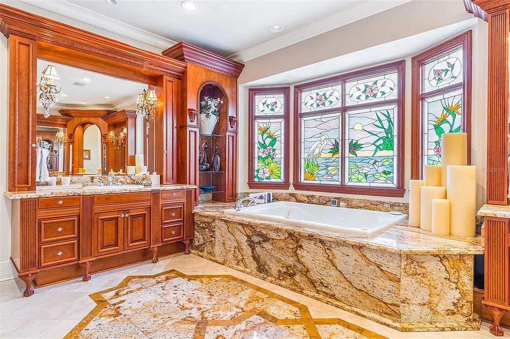 Experience luxury living at its finest with Bellissimo Palazzo at 2020 Brightwaters Boulevard NE, a prestigious waterfront estate in Saint Petersburg, Florida. This Italian-inspired masterpiece boasts 5 bedrooms, 9 bathrooms, and over 9,700 square feet of opulent living space. Immerse yourself in timeless architecture, exquisite finishes, and breathtaking waterfront views.