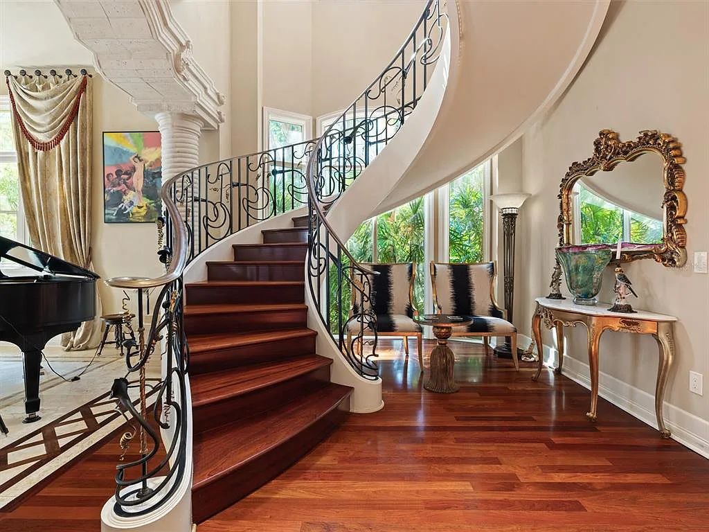 Experience luxury living at its finest with Bellissimo Palazzo at 2020 Brightwaters Boulevard NE, a prestigious waterfront estate in Saint Petersburg, Florida. This Italian-inspired masterpiece boasts 5 bedrooms, 9 bathrooms, and over 9,700 square feet of opulent living space. Immerse yourself in timeless architecture, exquisite finishes, and breathtaking waterfront views.