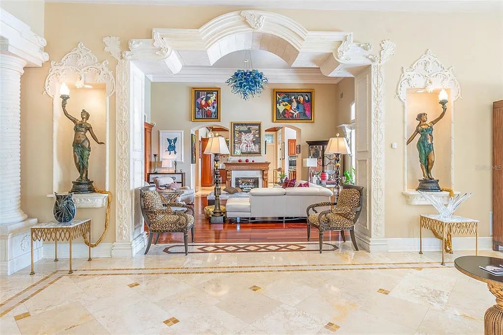 Experience luxury living at its finest with Bellissimo Palazzo at 2020 Brightwaters Boulevard NE, a prestigious waterfront estate in Saint Petersburg, Florida. This Italian-inspired masterpiece boasts 5 bedrooms, 9 bathrooms, and over 9,700 square feet of opulent living space. Immerse yourself in timeless architecture, exquisite finishes, and breathtaking waterfront views.