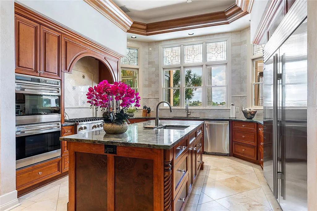 Experience luxury living at its finest with Bellissimo Palazzo at 2020 Brightwaters Boulevard NE, a prestigious waterfront estate in Saint Petersburg, Florida. This Italian-inspired masterpiece boasts 5 bedrooms, 9 bathrooms, and over 9,700 square feet of opulent living space. Immerse yourself in timeless architecture, exquisite finishes, and breathtaking waterfront views.