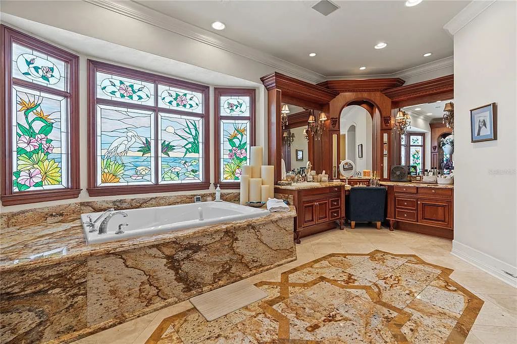 Experience luxury living at its finest with Bellissimo Palazzo at 2020 Brightwaters Boulevard NE, a prestigious waterfront estate in Saint Petersburg, Florida. This Italian-inspired masterpiece boasts 5 bedrooms, 9 bathrooms, and over 9,700 square feet of opulent living space. Immerse yourself in timeless architecture, exquisite finishes, and breathtaking waterfront views.