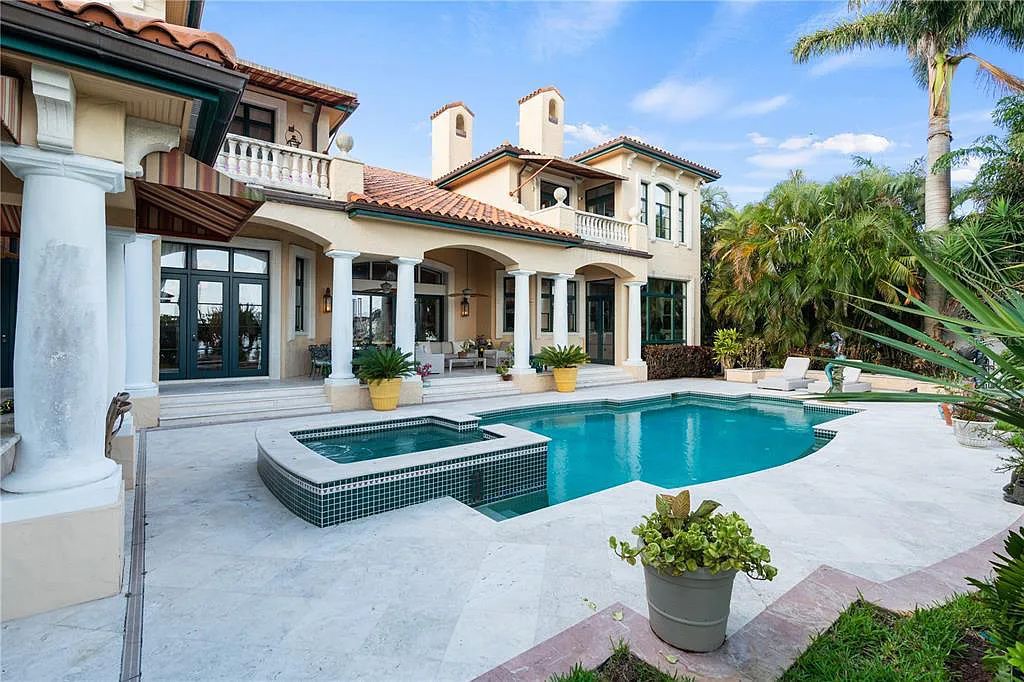 Experience luxury living at its finest with Bellissimo Palazzo at 2020 Brightwaters Boulevard NE, a prestigious waterfront estate in Saint Petersburg, Florida. This Italian-inspired masterpiece boasts 5 bedrooms, 9 bathrooms, and over 9,700 square feet of opulent living space. Immerse yourself in timeless architecture, exquisite finishes, and breathtaking waterfront views.