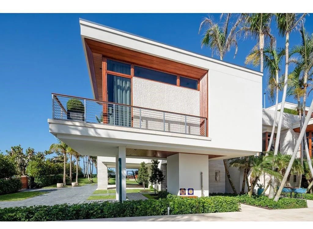 Introducing 25 16th Avenue S, a magnificent beachfront estate in Naples, Florida. This modern masterpiece, designed by Stofft Cooney Architects, LLC and constructed by Newbury North Associates, Inc., offers captivating views of Naples beach and the Gulf of Mexico.