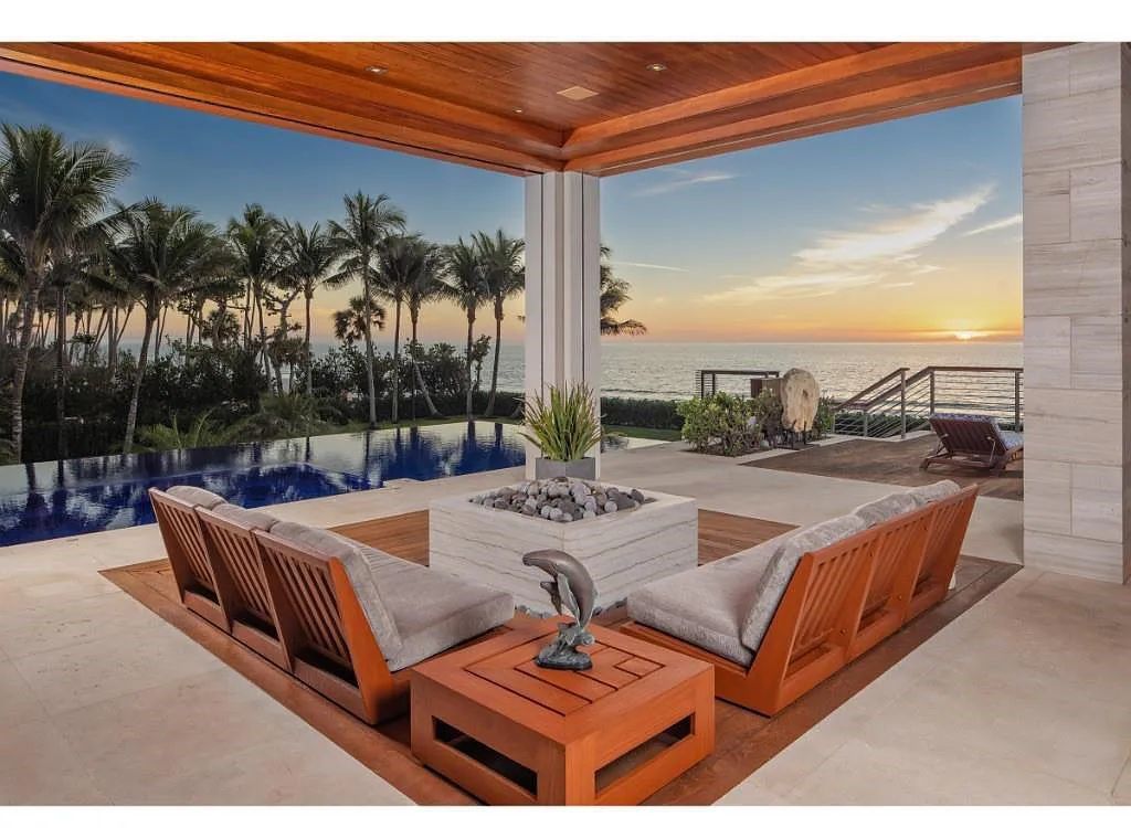 Introducing 25 16th Avenue S, a magnificent beachfront estate in Naples, Florida. This modern masterpiece, designed by Stofft Cooney Architects, LLC and constructed by Newbury North Associates, Inc., offers captivating views of Naples beach and the Gulf of Mexico.