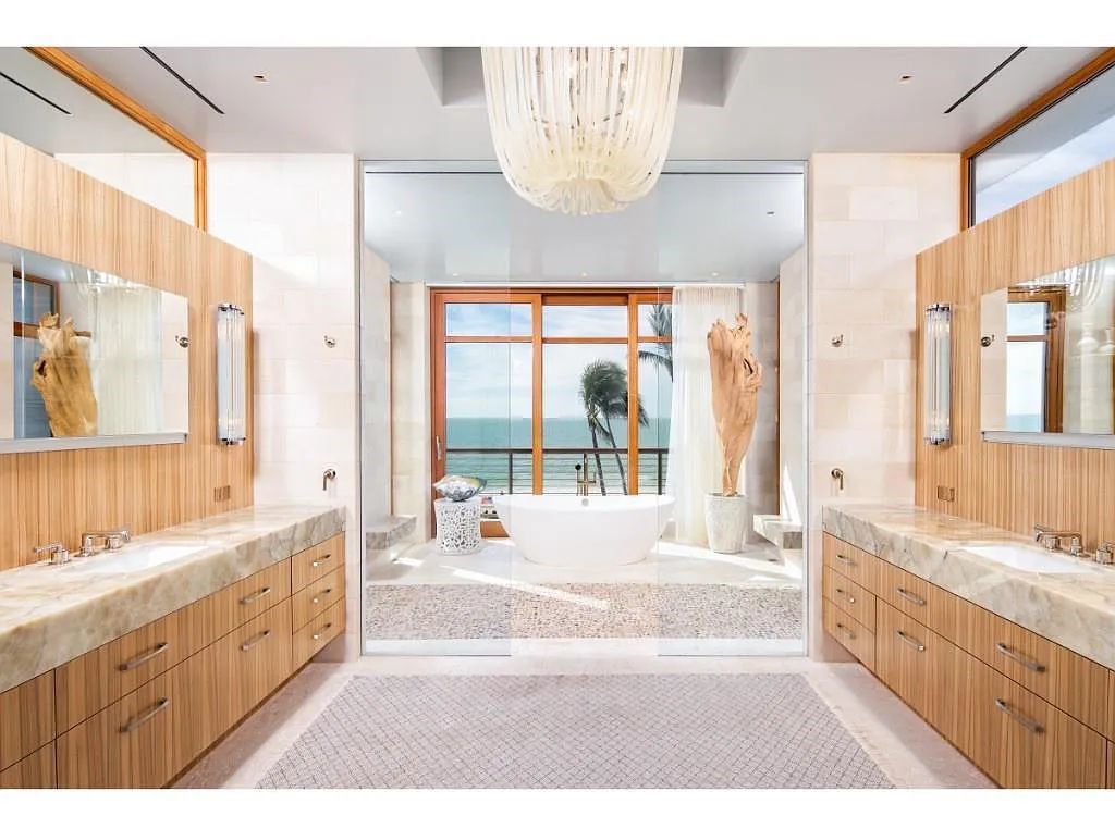 Introducing 25 16th Avenue S, a magnificent beachfront estate in Naples, Florida. This modern masterpiece, designed by Stofft Cooney Architects, LLC and constructed by Newbury North Associates, Inc., offers captivating views of Naples beach and the Gulf of Mexico.