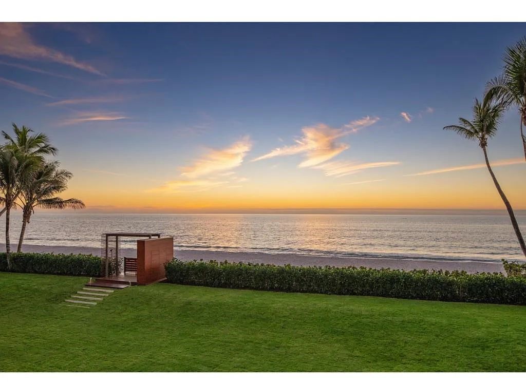 Introducing 25 16th Avenue S, a magnificent beachfront estate in Naples, Florida. This modern masterpiece, designed by Stofft Cooney Architects, LLC and constructed by Newbury North Associates, Inc., offers captivating views of Naples beach and the Gulf of Mexico.