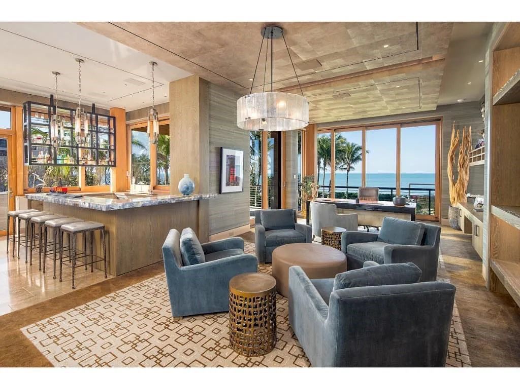 Introducing 25 16th Avenue S, a magnificent beachfront estate in Naples, Florida. This modern masterpiece, designed by Stofft Cooney Architects, LLC and constructed by Newbury North Associates, Inc., offers captivating views of Naples beach and the Gulf of Mexico.