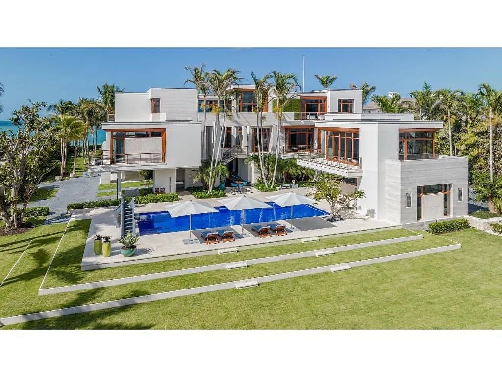 Introducing 25 16th Avenue S, a magnificent beachfront estate in Naples, Florida. This modern masterpiece, designed by Stofft Cooney Architects, LLC and constructed by Newbury North Associates, Inc., offers captivating views of Naples beach and the Gulf of Mexico.