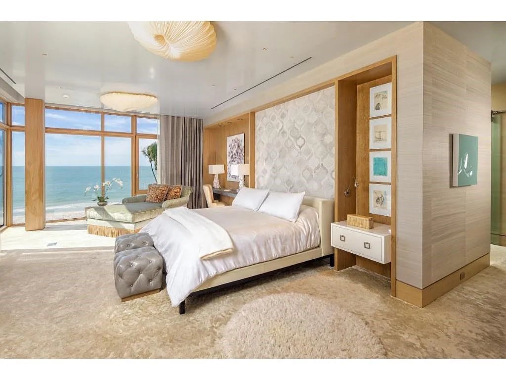 Introducing 25 16th Avenue S, a magnificent beachfront estate in Naples, Florida. This modern masterpiece, designed by Stofft Cooney Architects, LLC and constructed by Newbury North Associates, Inc., offers captivating views of Naples beach and the Gulf of Mexico.