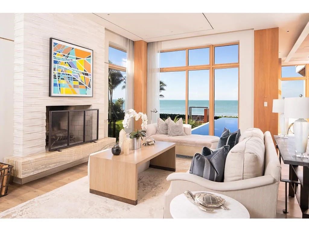 Introducing 25 16th Avenue S, a magnificent beachfront estate in Naples, Florida. This modern masterpiece, designed by Stofft Cooney Architects, LLC and constructed by Newbury North Associates, Inc., offers captivating views of Naples beach and the Gulf of Mexico.