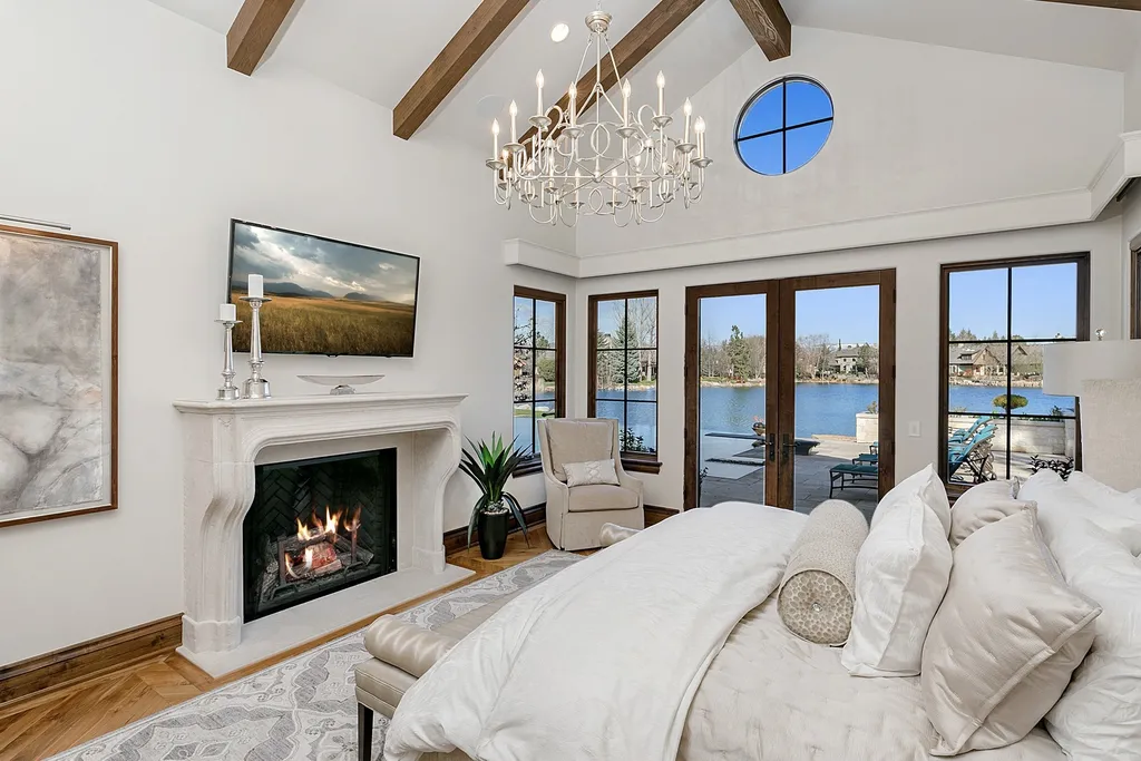 1454 S Heron Pointe Lane Home in Eagle, Idaho. Discover the epitome of luxury and quality in this exceptional Santa Barbara style custom home. Built by renowned Northern Construction and designed by acclaimed architect Trey Hoff, this 1.5-acre waterfront property boasts stunning Spanish Colonial architecture. Step into a world of elegance with an infinity pool, spa, and covered outdoor living area featuring custom sound, heaters, televisions, fireplace, and lighting.