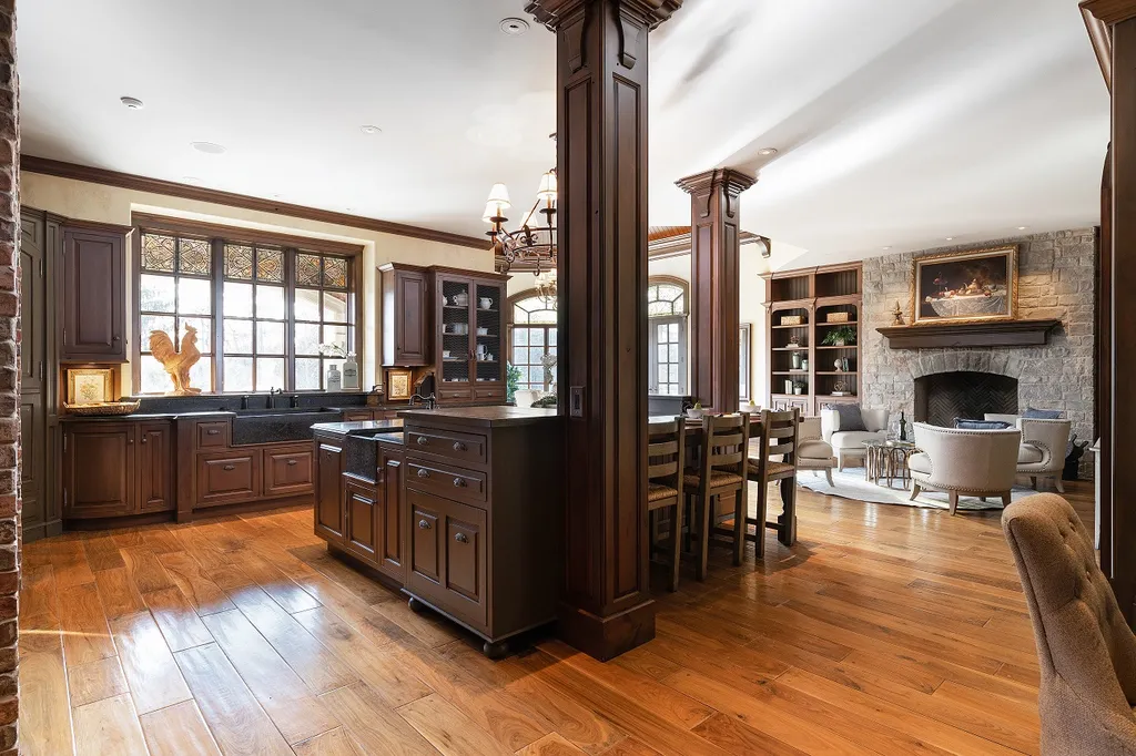 1558 Dutton Road Home in Rochester, Michigan. Discover the epitome of luxury living at this Country Estate in Oakland Township. Spread across 22 acres, the home features hand-carved wooden archways, hand-painted ceiling frescos, and hand-cut stone and gold-leafed accents.