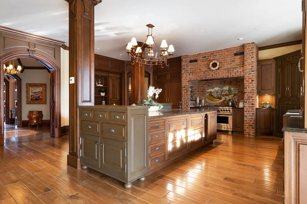 1558 Dutton Road Home in Rochester, Michigan. Discover the epitome of luxury living at this Country Estate in Oakland Township. Spread across 22 acres, the home features hand-carved wooden archways, hand-painted ceiling frescos, and hand-cut stone and gold-leafed accents.
