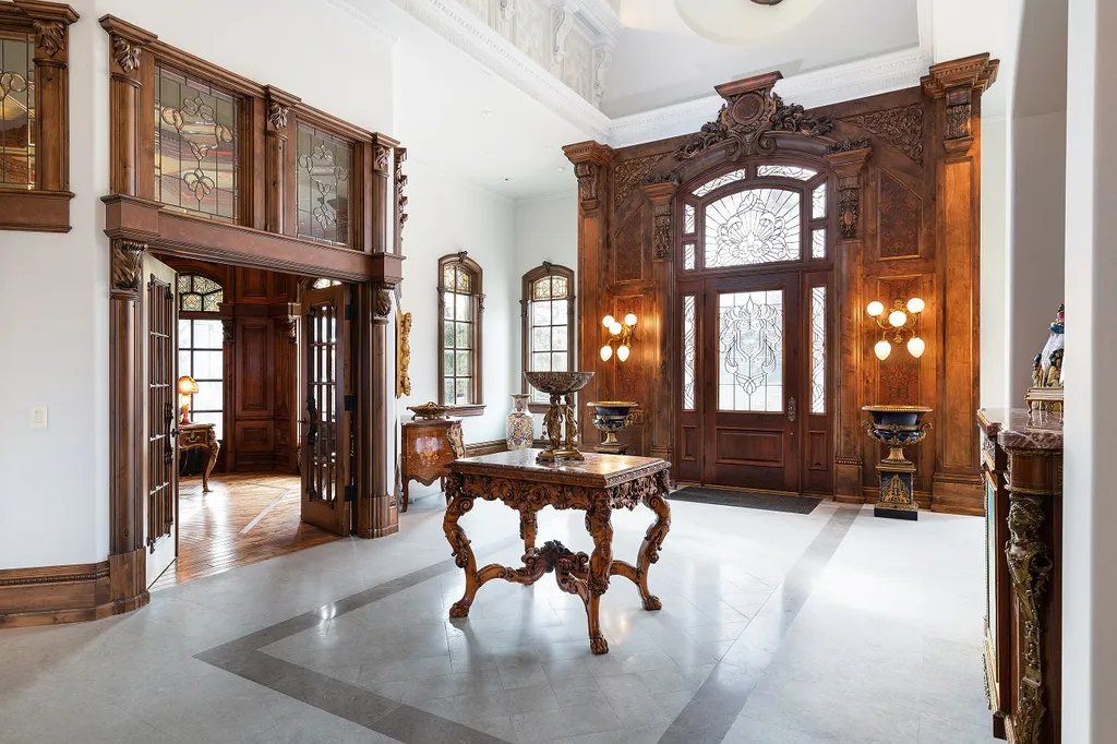 1558 Dutton Road Home in Rochester, Michigan. Discover the epitome of luxury living at this Country Estate in Oakland Township. Spread across 22 acres, the home features hand-carved wooden archways, hand-painted ceiling frescos, and hand-cut stone and gold-leafed accents.