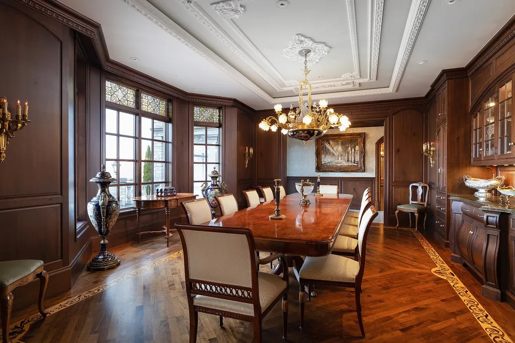 1558 Dutton Road Home in Rochester, Michigan. Discover the epitome of luxury living at this Country Estate in Oakland Township. Spread across 22 acres, the home features hand-carved wooden archways, hand-painted ceiling frescos, and hand-cut stone and gold-leafed accents.