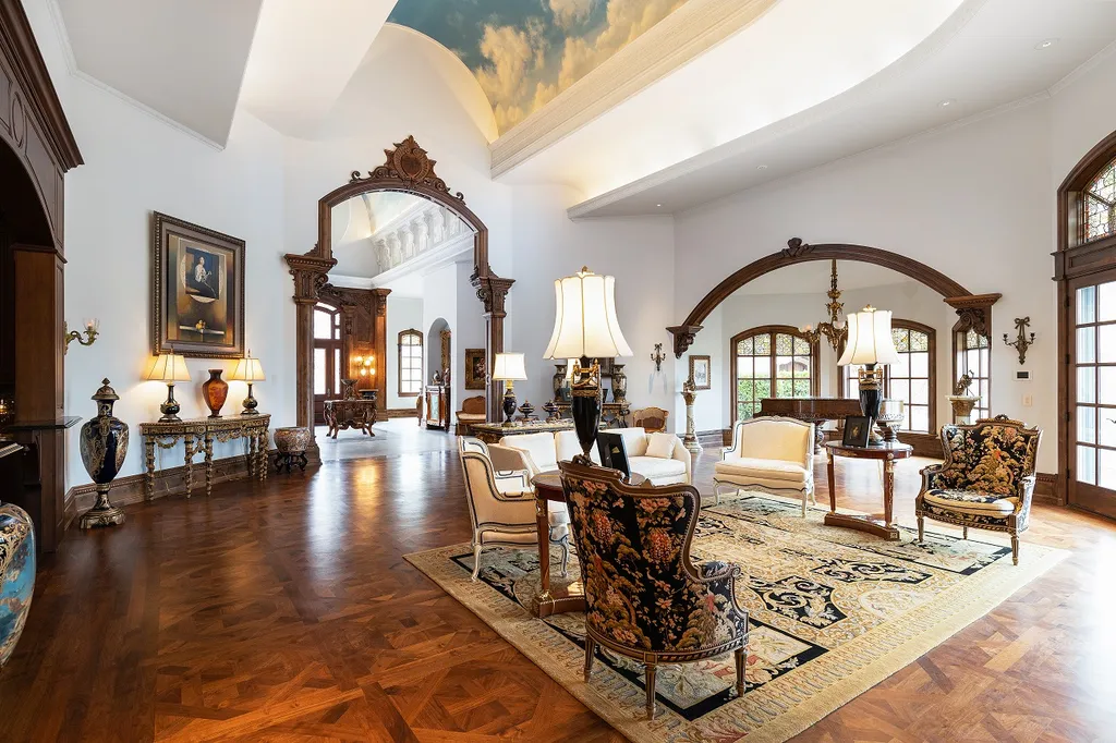 1558 Dutton Road Home in Rochester, Michigan. Discover the epitome of luxury living at this Country Estate in Oakland Township. Spread across 22 acres, the home features hand-carved wooden archways, hand-painted ceiling frescos, and hand-cut stone and gold-leafed accents.
