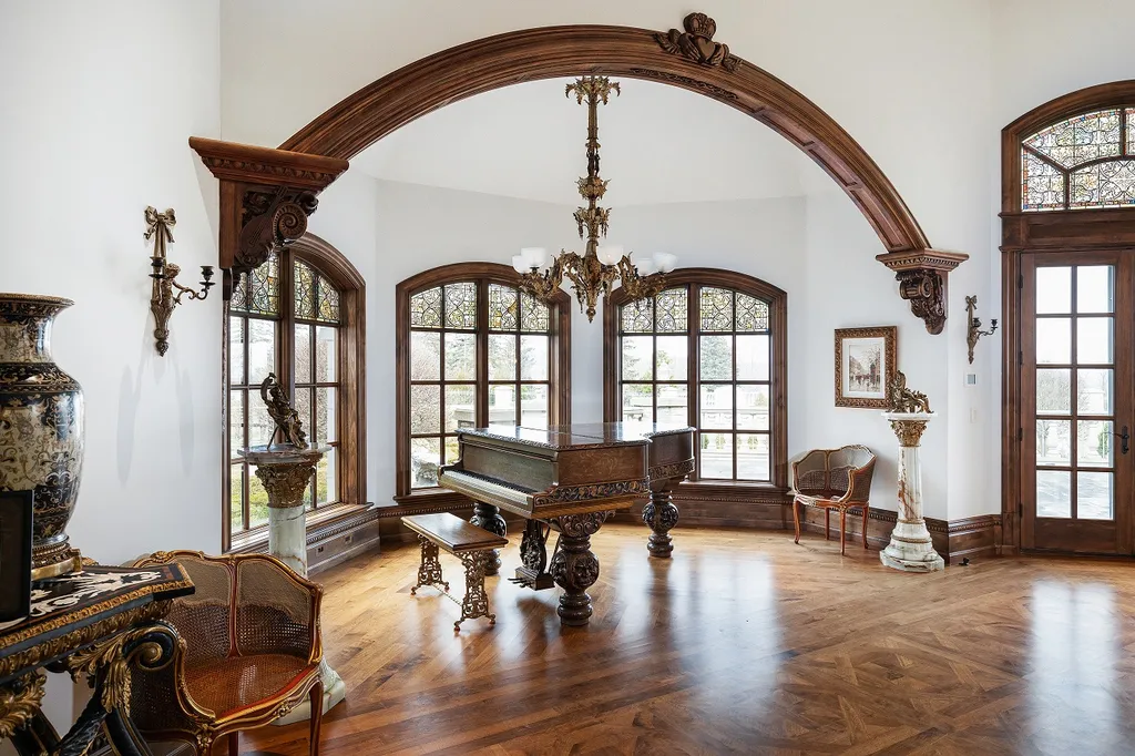 1558 Dutton Road Home in Rochester, Michigan. Discover the epitome of luxury living at this Country Estate in Oakland Township. Spread across 22 acres, the home features hand-carved wooden archways, hand-painted ceiling frescos, and hand-cut stone and gold-leafed accents.