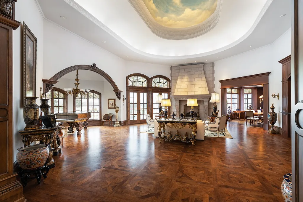 1558 Dutton Road Home in Rochester, Michigan. Discover the epitome of luxury living at this Country Estate in Oakland Township. Spread across 22 acres, the home features hand-carved wooden archways, hand-painted ceiling frescos, and hand-cut stone and gold-leafed accents.
