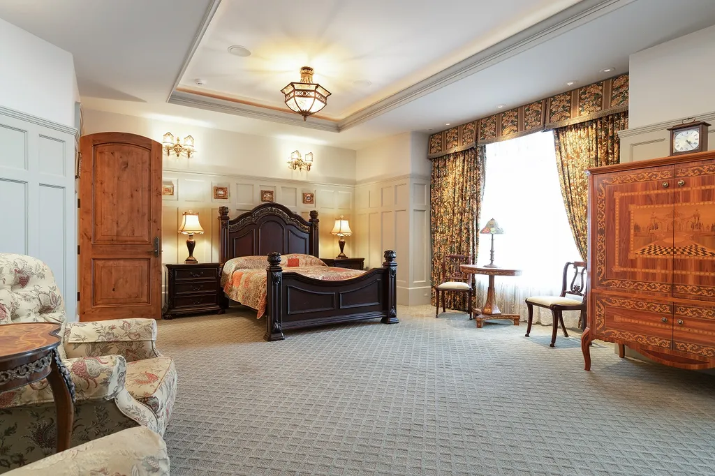 1558 Dutton Road Home in Rochester, Michigan. Discover the epitome of luxury living at this Country Estate in Oakland Township. Spread across 22 acres, the home features hand-carved wooden archways, hand-painted ceiling frescos, and hand-cut stone and gold-leafed accents.