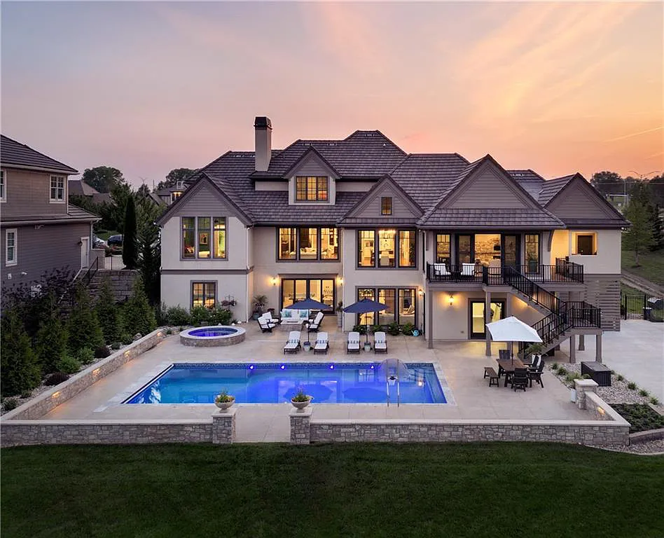 15905 Cody Street Home in Overland Park, Kansas. Step into the world of luxury with this custom-built Holthaus estate featuring magazine-worthy interiors and extensive upgrades. From arched doorways to wide plank rough sawn wood floors, every detail exudes beauty and practicality. Enjoy generous room sizes, beamed ceilings, and designer finishes throughout the 9,000+ square feet of living space. 