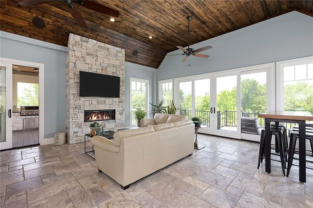 15905 Cody Street Home in Overland Park, Kansas. Step into the world of luxury with this custom-built Holthaus estate featuring magazine-worthy interiors and extensive upgrades. From arched doorways to wide plank rough sawn wood floors, every detail exudes beauty and practicality. Enjoy generous room sizes, beamed ceilings, and designer finishes throughout the 9,000+ square feet of living space. 