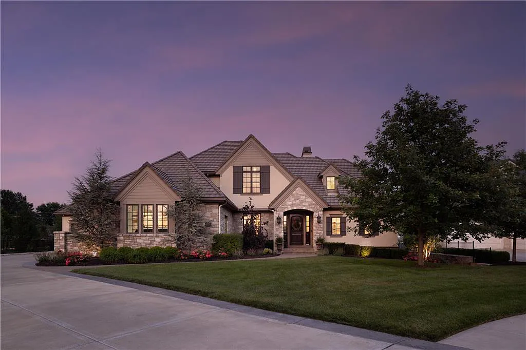 15905 Cody Street Home in Overland Park, Kansas. Step into the world of luxury with this custom-built Holthaus estate featuring magazine-worthy interiors and extensive upgrades. From arched doorways to wide plank rough sawn wood floors, every detail exudes beauty and practicality. Enjoy generous room sizes, beamed ceilings, and designer finishes throughout the 9,000+ square feet of living space. 