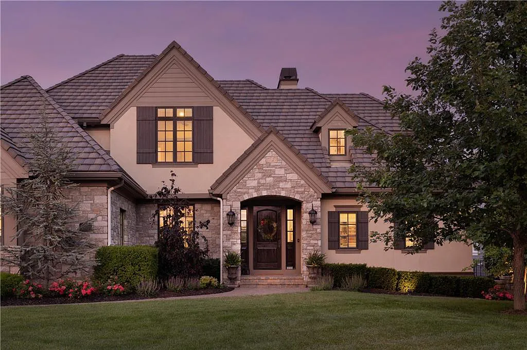 15905 Cody Street Home in Overland Park, Kansas. Step into the world of luxury with this custom-built Holthaus estate featuring magazine-worthy interiors and extensive upgrades. From arched doorways to wide plank rough sawn wood floors, every detail exudes beauty and practicality. Enjoy generous room sizes, beamed ceilings, and designer finishes throughout the 9,000+ square feet of living space. 