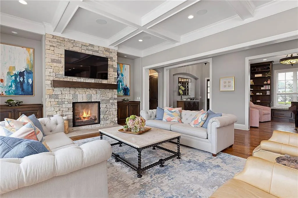 15905 Cody Street Home in Overland Park, Kansas. Step into the world of luxury with this custom-built Holthaus estate featuring magazine-worthy interiors and extensive upgrades. From arched doorways to wide plank rough sawn wood floors, every detail exudes beauty and practicality. Enjoy generous room sizes, beamed ceilings, and designer finishes throughout the 9,000+ square feet of living space. 
