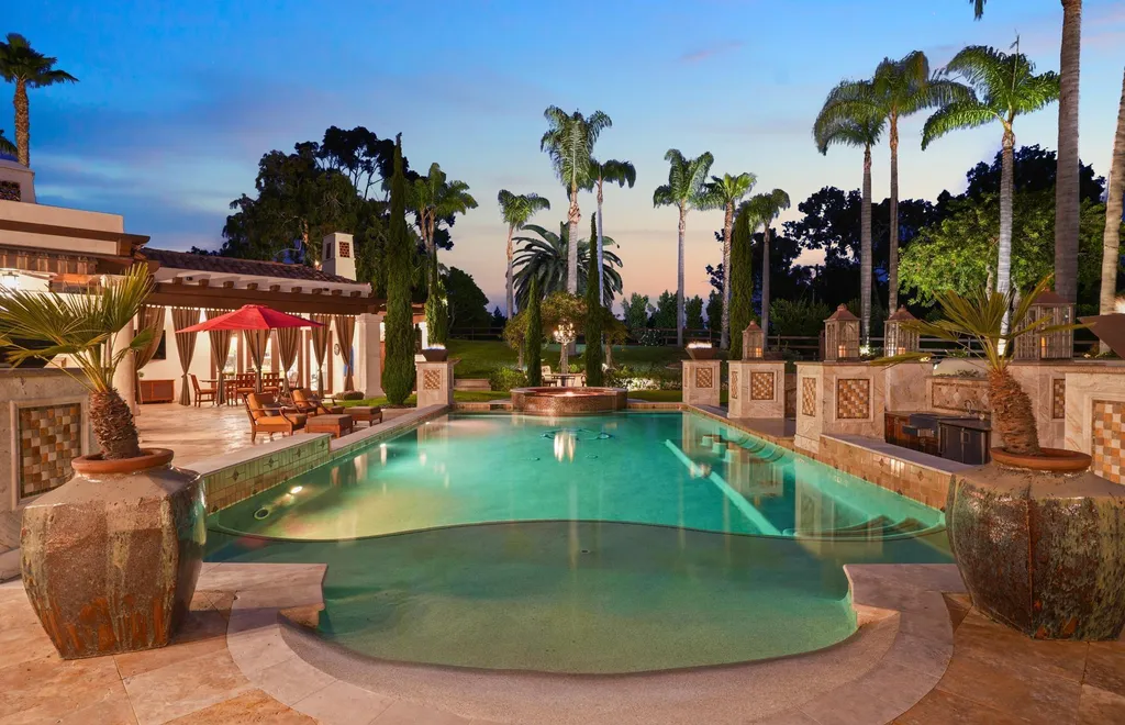 16756 Los Morros Home in Rancho Santa Fe, California. Explore this magnificent Mediterranean estate in Rancho Santa Fe's coveted Covenant. Situated on nearly two acres of lush grounds, this grand residence effortlessly combines opulence with a welcoming ambiance. With impressive features including a paradise pool, gourmet kitchen, spacious living areas, and luxurious amenities, this estate offers the epitome of refined living. Discover a luxurious retreat that seamlessly blends grandeur, comfort, and sophistication in one of Southern California's most prestigious neighborhoods.