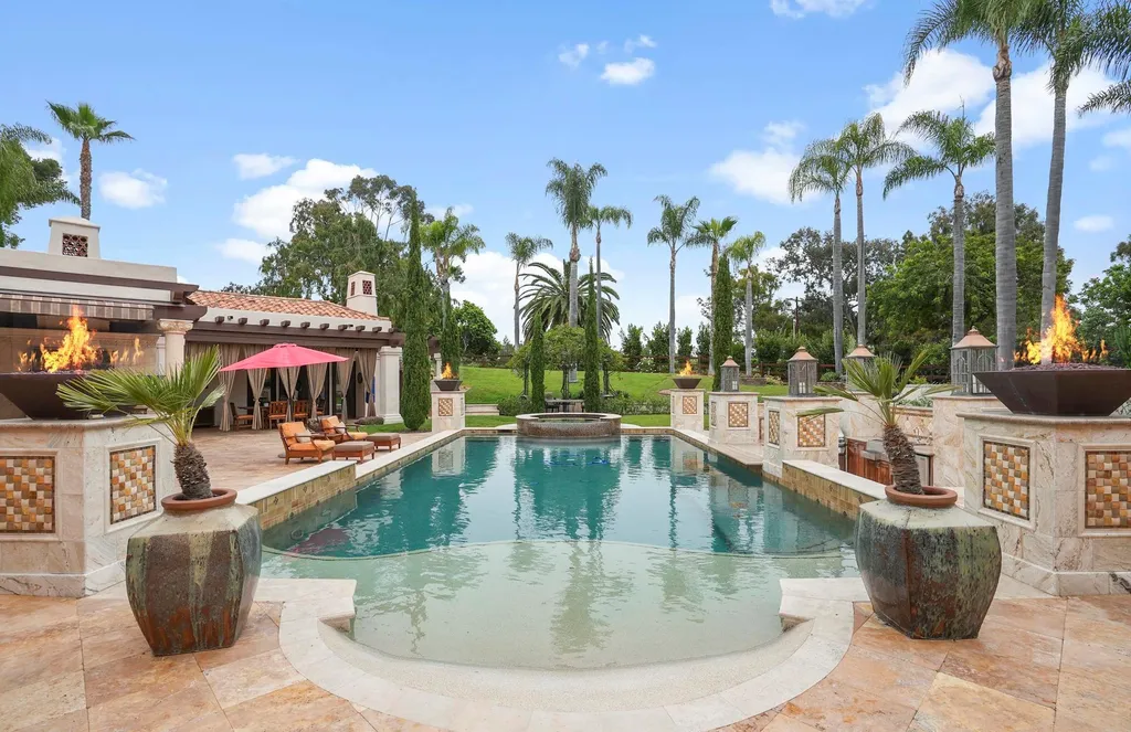 16756 Los Morros Home in Rancho Santa Fe, California. Explore this magnificent Mediterranean estate in Rancho Santa Fe's coveted Covenant. Situated on nearly two acres of lush grounds, this grand residence effortlessly combines opulence with a welcoming ambiance. With impressive features including a paradise pool, gourmet kitchen, spacious living areas, and luxurious amenities, this estate offers the epitome of refined living. Discover a luxurious retreat that seamlessly blends grandeur, comfort, and sophistication in one of Southern California's most prestigious neighborhoods.