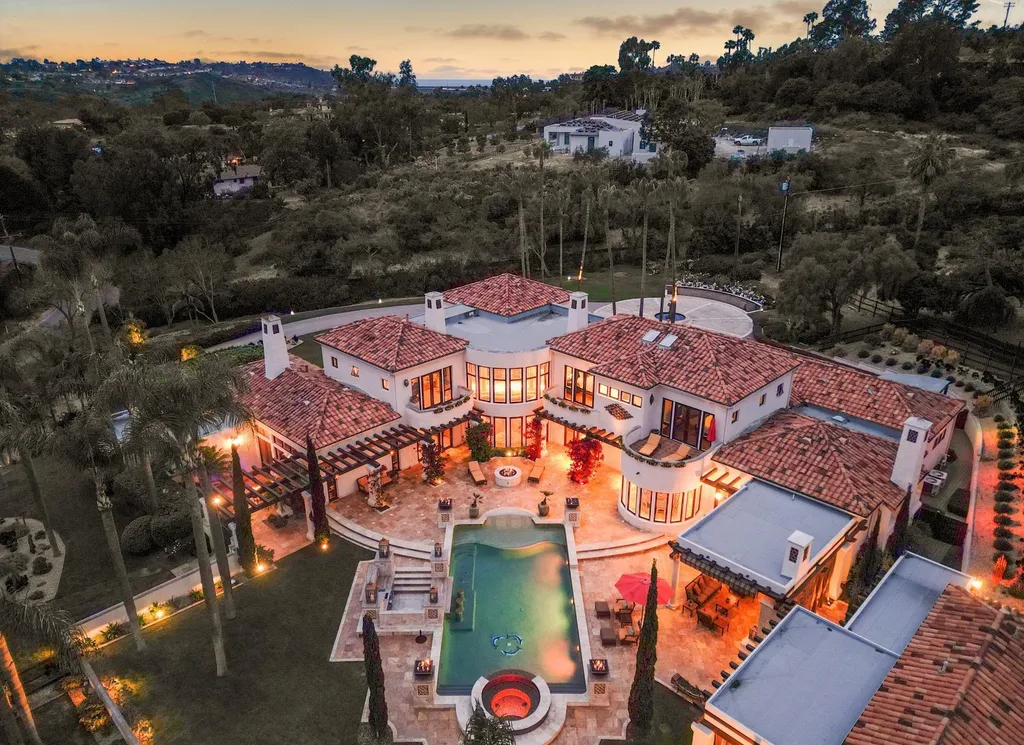 16756 Los Morros Home in Rancho Santa Fe, California. Explore this magnificent Mediterranean estate in Rancho Santa Fe's coveted Covenant. Situated on nearly two acres of lush grounds, this grand residence effortlessly combines opulence with a welcoming ambiance. With impressive features including a paradise pool, gourmet kitchen, spacious living areas, and luxurious amenities, this estate offers the epitome of refined living. Discover a luxurious retreat that seamlessly blends grandeur, comfort, and sophistication in one of Southern California's most prestigious neighborhoods.