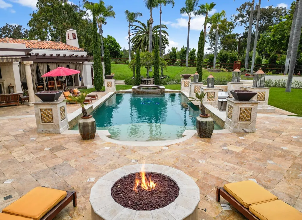 16756 Los Morros Home in Rancho Santa Fe, California. Explore this magnificent Mediterranean estate in Rancho Santa Fe's coveted Covenant. Situated on nearly two acres of lush grounds, this grand residence effortlessly combines opulence with a welcoming ambiance. With impressive features including a paradise pool, gourmet kitchen, spacious living areas, and luxurious amenities, this estate offers the epitome of refined living. Discover a luxurious retreat that seamlessly blends grandeur, comfort, and sophistication in one of Southern California's most prestigious neighborhoods.