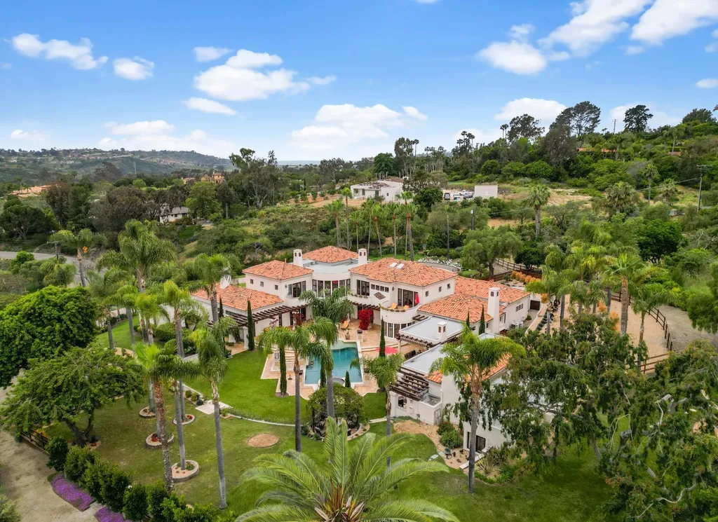 16756 Los Morros Home in Rancho Santa Fe, California. Explore this magnificent Mediterranean estate in Rancho Santa Fe's coveted Covenant. Situated on nearly two acres of lush grounds, this grand residence effortlessly combines opulence with a welcoming ambiance. With impressive features including a paradise pool, gourmet kitchen, spacious living areas, and luxurious amenities, this estate offers the epitome of refined living. Discover a luxurious retreat that seamlessly blends grandeur, comfort, and sophistication in one of Southern California's most prestigious neighborhoods.