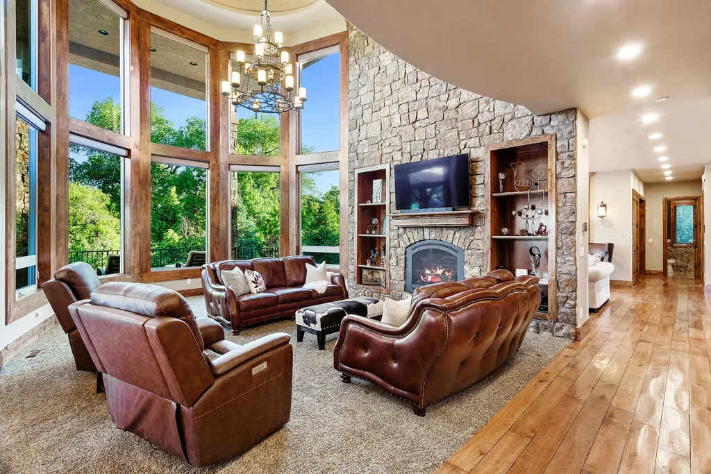 17476 West 69th Avenue Home in Arvada, Colorado. Step into a true work of art in this premier Arvada estate. Custom-built with meticulous attention to detail, this Old European-inspired home boasts luxury finishes, en-suite bedrooms, and high-tech smart home upgrades. Enjoy 7,614 sqft of living space, featuring a state-of-the-art home theater, gourmet kitchen, European sauna room, and more. 