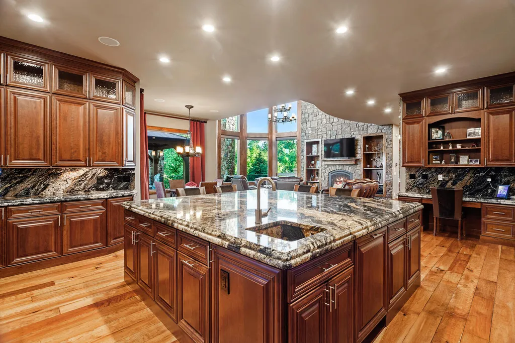 17476 West 69th Avenue Home in Arvada, Colorado. Step into a true work of art in this premier Arvada estate. Custom-built with meticulous attention to detail, this Old European-inspired home boasts luxury finishes, en-suite bedrooms, and high-tech smart home upgrades. Enjoy 7,614 sqft of living space, featuring a state-of-the-art home theater, gourmet kitchen, European sauna room, and more. 