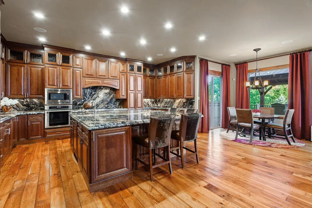 17476 West 69th Avenue Home in Arvada, Colorado. Step into a true work of art in this premier Arvada estate. Custom-built with meticulous attention to detail, this Old European-inspired home boasts luxury finishes, en-suite bedrooms, and high-tech smart home upgrades. Enjoy 7,614 sqft of living space, featuring a state-of-the-art home theater, gourmet kitchen, European sauna room, and more. 