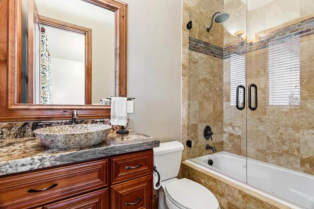 17476 West 69th Avenue Home in Arvada, Colorado. Step into a true work of art in this premier Arvada estate. Custom-built with meticulous attention to detail, this Old European-inspired home boasts luxury finishes, en-suite bedrooms, and high-tech smart home upgrades. Enjoy 7,614 sqft of living space, featuring a state-of-the-art home theater, gourmet kitchen, European sauna room, and more. 