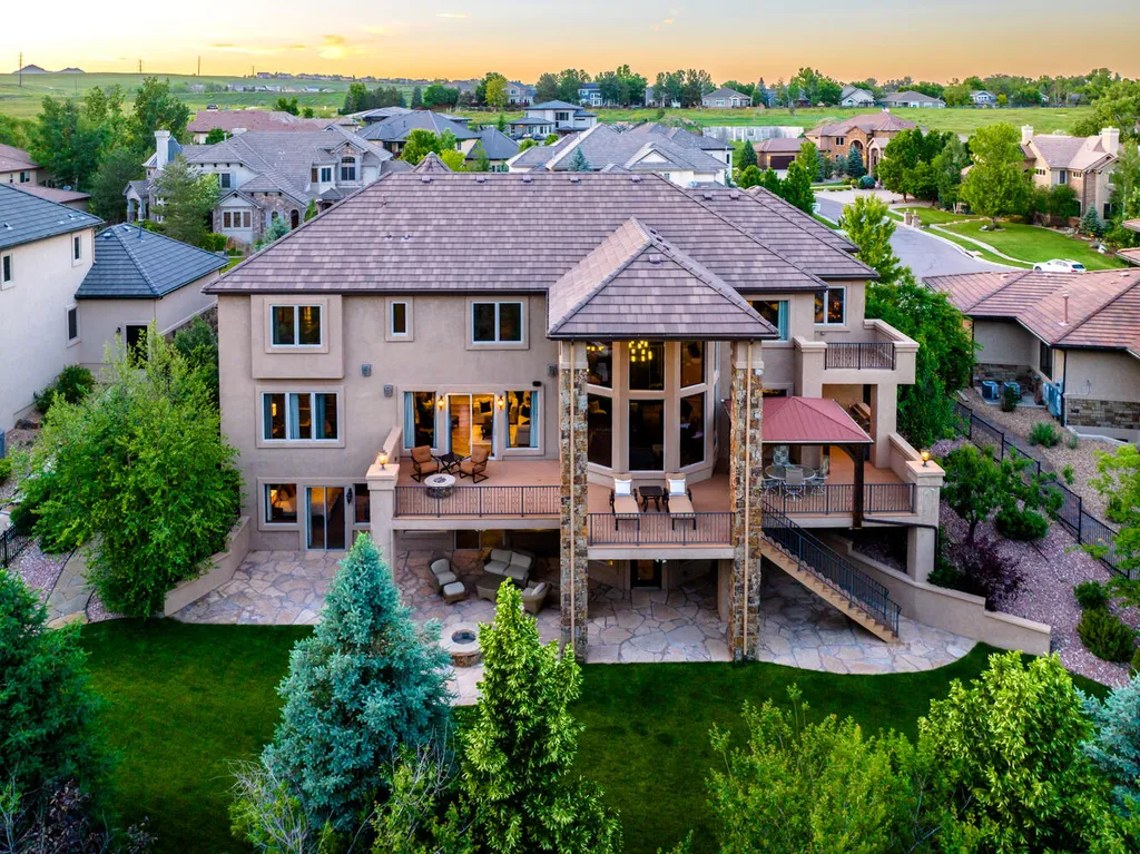 17476 West 69th Avenue Home in Arvada, Colorado. Step into a true work of art in this premier Arvada estate. Custom-built with meticulous attention to detail, this Old European-inspired home boasts luxury finishes, en-suite bedrooms, and high-tech smart home upgrades. Enjoy 7,614 sqft of living space, featuring a state-of-the-art home theater, gourmet kitchen, European sauna room, and more. 