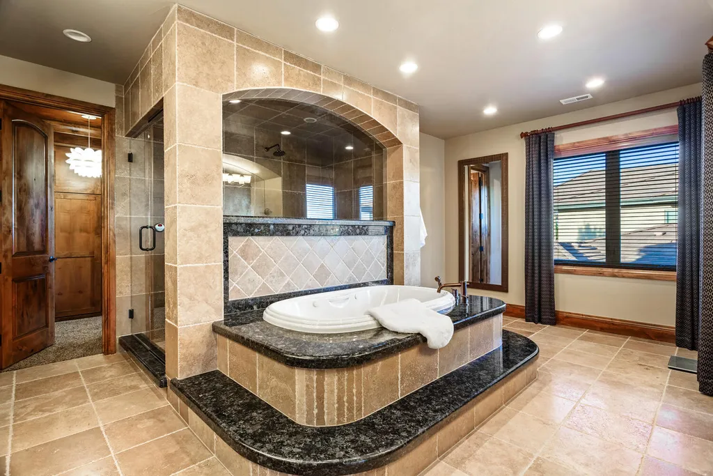 17476 West 69th Avenue Home in Arvada, Colorado. Step into a true work of art in this premier Arvada estate. Custom-built with meticulous attention to detail, this Old European-inspired home boasts luxury finishes, en-suite bedrooms, and high-tech smart home upgrades. Enjoy 7,614 sqft of living space, featuring a state-of-the-art home theater, gourmet kitchen, European sauna room, and more. 