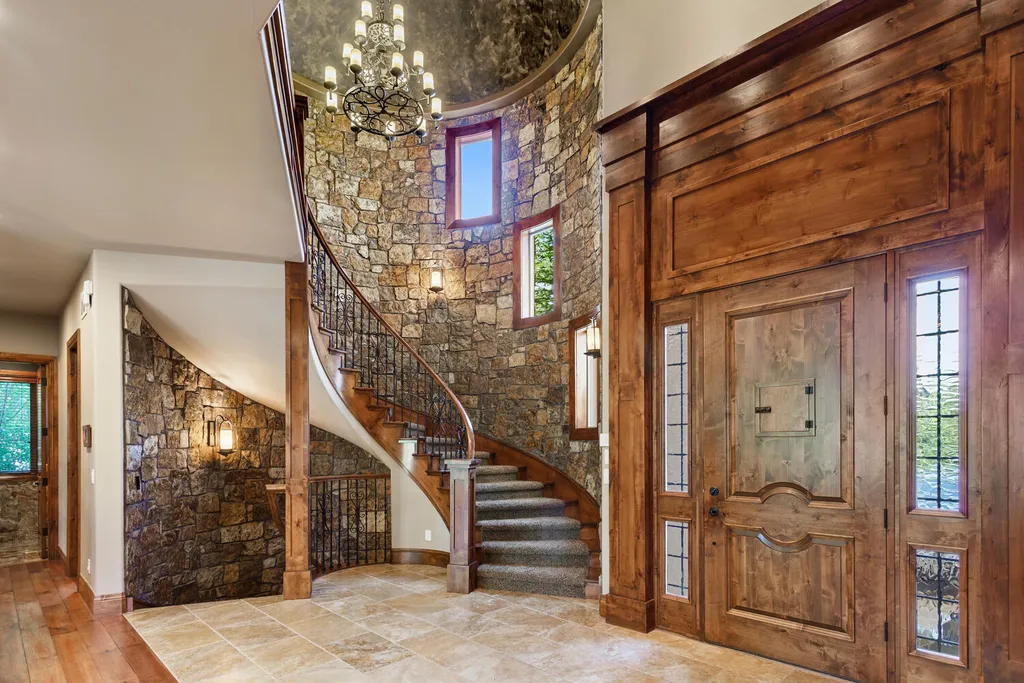 17476 West 69th Avenue Home in Arvada, Colorado. Step into a true work of art in this premier Arvada estate. Custom-built with meticulous attention to detail, this Old European-inspired home boasts luxury finishes, en-suite bedrooms, and high-tech smart home upgrades. Enjoy 7,614 sqft of living space, featuring a state-of-the-art home theater, gourmet kitchen, European sauna room, and more. 