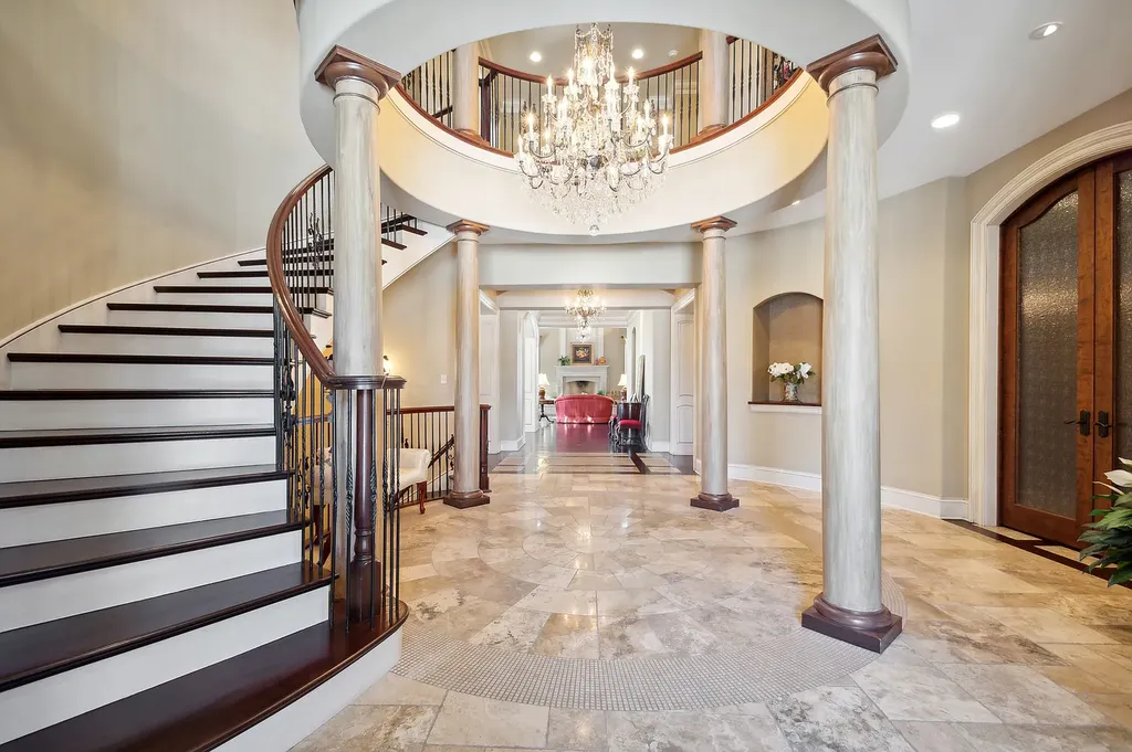 2 Rock Ridge Road Home in Barrington, Illinois. Discover the beauty of this one-of-a-kind estate in Barrington Hills, situated on 12.3 acres of picturesque land. This stunning home showcases expert craftsmanship, finest materials, and luxurious amenities. 