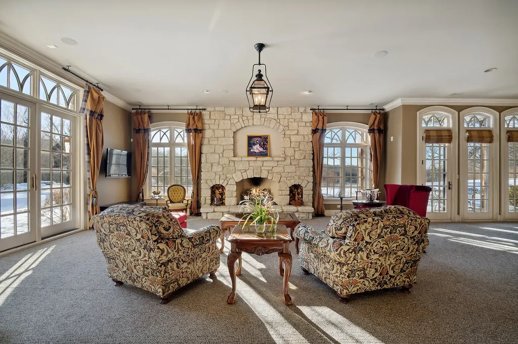 2 Rock Ridge Road Home in Barrington, Illinois. Discover the beauty of this one-of-a-kind estate in Barrington Hills, situated on 12.3 acres of picturesque land. This stunning home showcases expert craftsmanship, finest materials, and luxurious amenities. 