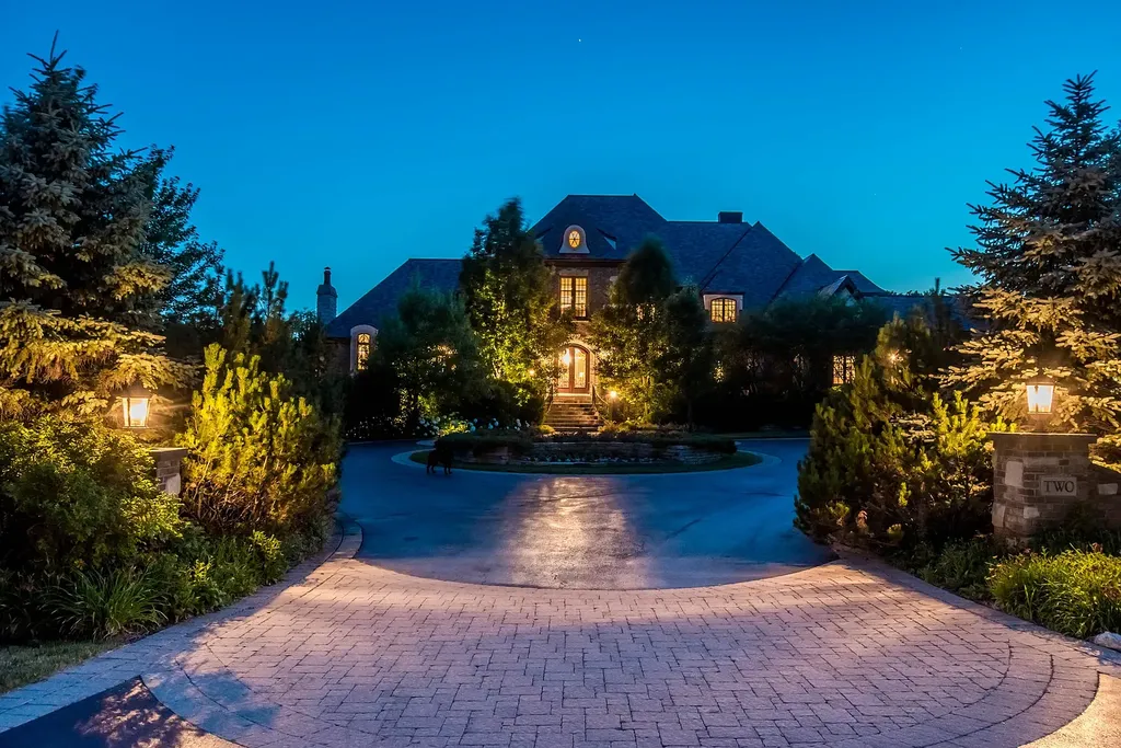 2 Rock Ridge Road Home in Barrington, Illinois. Discover the beauty of this one-of-a-kind estate in Barrington Hills, situated on 12.3 acres of picturesque land. This stunning home showcases expert craftsmanship, finest materials, and luxurious amenities. 