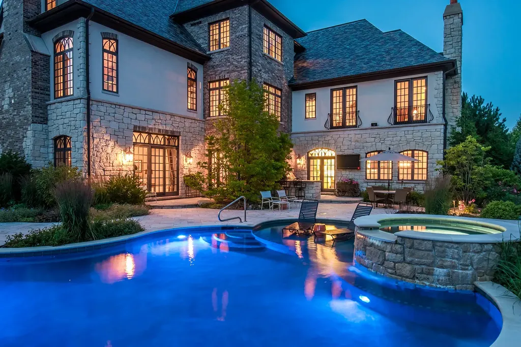 2 Rock Ridge Road Home in Barrington, Illinois. Discover the beauty of this one-of-a-kind estate in Barrington Hills, situated on 12.3 acres of picturesque land. This stunning home showcases expert craftsmanship, finest materials, and luxurious amenities. 